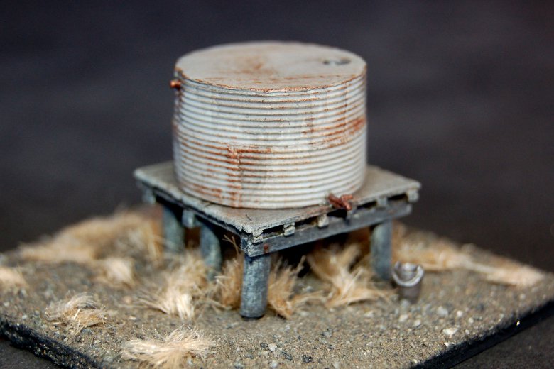 Squat corrugated iron water tank on high tower